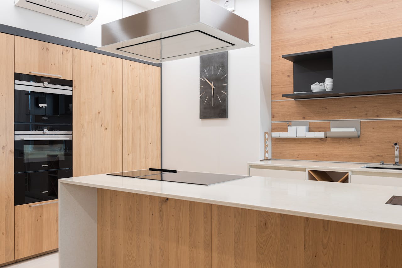 Sleek and contemporary kitchen with wooden finishes and modern appliances.